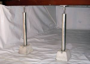 A  Sandy crawl space support system repairing a sagging structure.