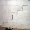 A diagonal stair step crack along the foundation wall of a American Fork home