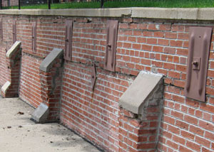 Rusted wall plate anchors in a retaining wall repair in Vernal.