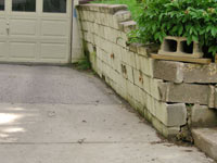 a failing retaining wall around a driveway in Salt Lake City