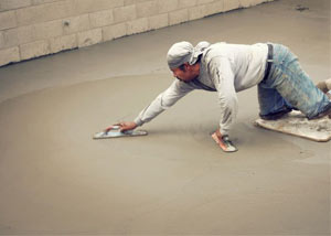 smoothing out the grout in a slab releveling project in Tooele