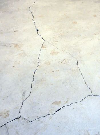 severely cracked, heaving slab floors in a home in Spanish Fork
