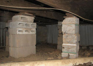 crawl space repairs done with concrete cinder blocks and wood shims in a American Fork home