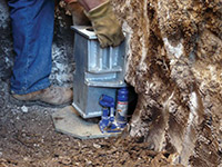 Securing a foundation footing bracket for a foundation repair system in Saint George.