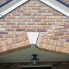 Major tuckpointing on a home archway over a door, with tuckpointing several inches wide that has failed on a Salt Lake City home