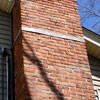 A tilting chimney on a Payson home with a leaning, tilting chimney that was temporarily repaired.