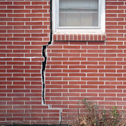 A foundation with a large crack that's wider at the top than on the bottom in Brigham City