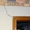 A large settlement crack on interior drywall in a Roy home.