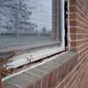 A gap in a window along the outer wall due to foundation settlement of a Bountiful home.