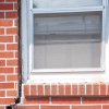 A gap in a window along the outer wall due to foundation settlement of a Bountiful home.