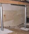 A system of crawl space support posts adding structural support to a crawl space in Springville