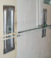 A foundation wall anchor system used to repair a basement wall in Pleasant Grove