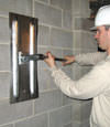 Tightening a wall anchor plate in Draper, Utah