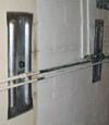 Foundation wall anchor plates installed in a basement in Park City