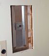 Wall anchor plates installed during a foundation repair in Price in a finished basement