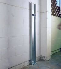 A failing foundation wall repaired with a foundation wall channel anchor system in a Draper home.