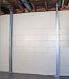 A steel i-beam system installed on a Centerville foundation wall