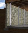 I-beam foundation wall supports installed in a Payson basement.
