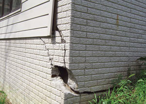 A severely damaged foundation wall in Sandy