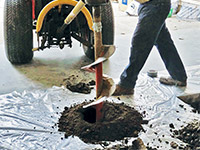 Digging the hole used for wall anchor installation in Midvale.