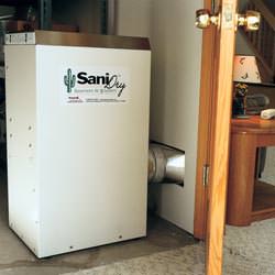 A basement dehumidifier with an ENERGY STAR® rating ducting dry air into a finished area of the basement  in Springville
