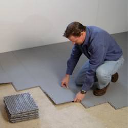 basement subfloor tiles being installed by a contractor in Spanish Fork