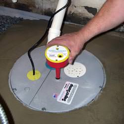 A newly installed sump pump system in a basement in Pleasant Grove