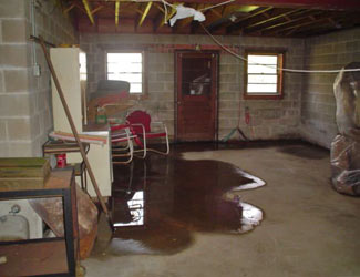 a flooded basement floor in a Springville home