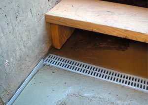 a hatchway entrance in Cedar City that has been protected from flooding by our TrenchDrain basement drainage system.