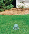 A buried gutter drain downspout extension installed in a Springville home