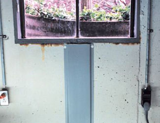 Repaired waterproofed basement window leak in Draper
