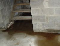 Water Pouring into a Layton Basement through Hatchway Doors